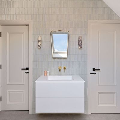 A clever shower head was the missing piece that turned this tricky, narrow space into a serene spa-like bathroom