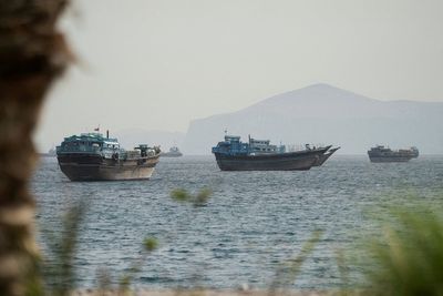 US strikes Iranian boats and missile sites to ‘protect our troops’