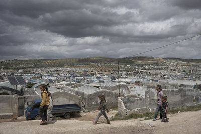 Cash-strapped Syrians living in tent settlements struggle to return home after Assad's fall