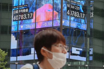 Japan's Nikkei hits record high as chip-related shares jump