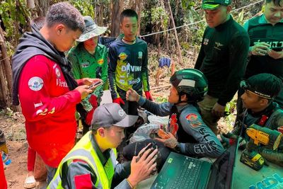 Rescuers ‘racing against time’ to save group trapped in flooded Laos cave