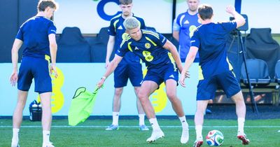 Scotland striker turns to hot pod yoga to prepare for humid World Cup conditions