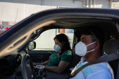 Thousands return home after California chemical tank threat, but fears linger