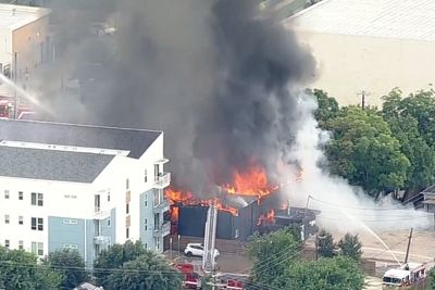 At least three dead after explosion at Dallas apartment complex as search continues