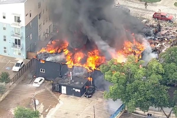 Dallas rescuers search for victims after gas explosion destroys building and ignites blaze