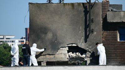 Russia accused of launching drone that hit apartment block in Romania, but Putin demands proof