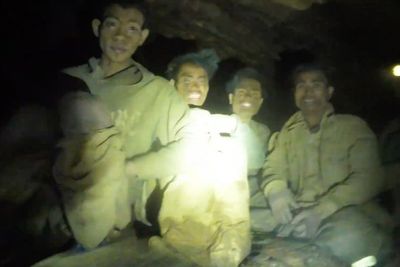 Rescuers work to drain flooded Laos cave to free 5 villagers and search for 2 still missing