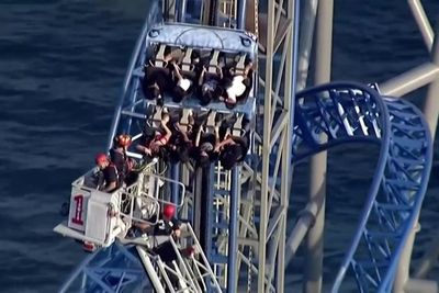 Rollercoaster riders stuck on 100ft vertical hill for hours after malfunction