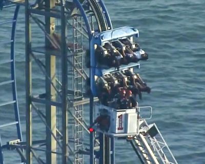 Eight students rescued after being stuck at top of rollercoaster for hours in Texas