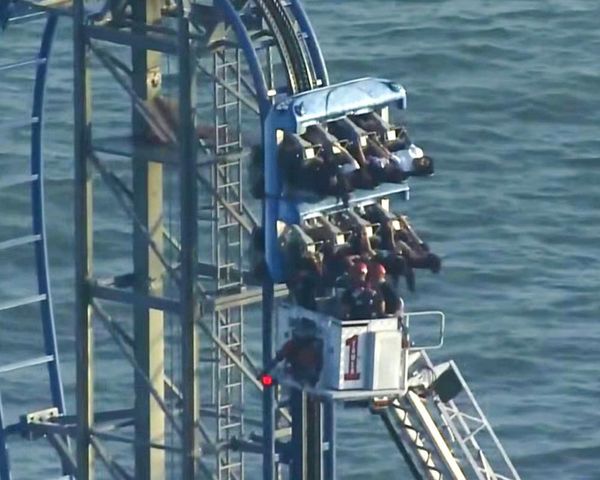 Eight students rescued after being stuck at top of rollercoaster for hours in Texas