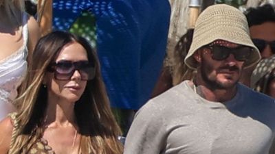 Victoria Beckham's floaty maxi dress and comfy tan sandals should be the blueprint for your holiday style