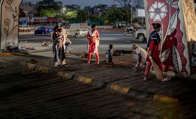 Life under a Delhi flyover: how one homeless family endures the city’s extreme heat