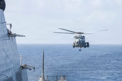 Damn the torpedoes — More ships are quietly slipping through the Strait of Hormuz as helicopters scare off Iran's fast-attack boats