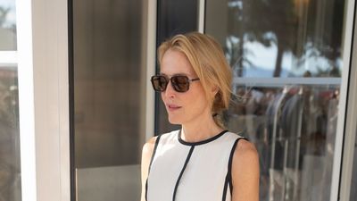 Gillian Anderson's pared-back outfit is a masterclass in timeless, monochrome dressing, as she steps out in this elegant ME+EM dress