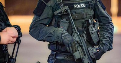 Armed police lock down busy Scottish city street in morning property search