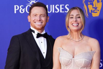 Stacey Solomon and Joe Swash celebrate Arsenal title win at bus parade