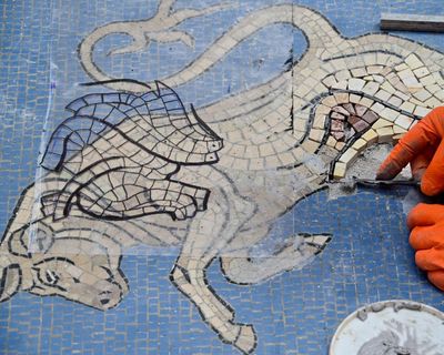 ‘What happened to the testicles?’: mockery in Milan over bull mosaic’s restoration
