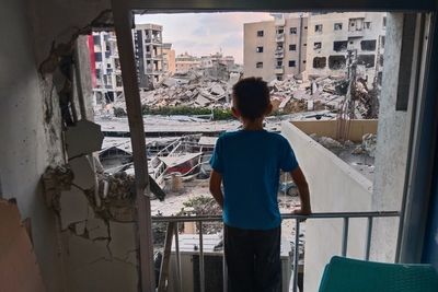 A Lebanese hospital is in ruins and people flee a Beirut suburb after Israel's threat, in photos