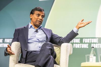 Cognizant CEO is swimming against the tide on AI: he's hiring over 20,000 graduates this year and says AI tokenmaxxing is a 'vanity metric'