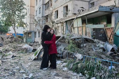 Russian attack on Ukraine capital kills at least 3 and traps others in damaged buildings