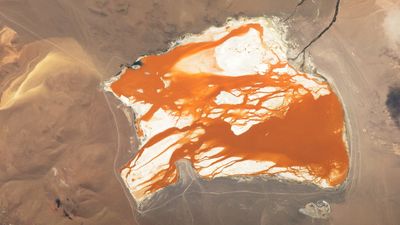 Rusty, orange water 'bleeds' across brilliant Bolivian lagoon — Earth from space