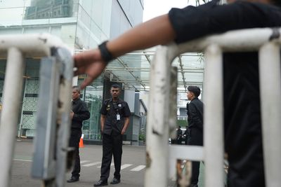 Investigators search Indonesian free meals agency after its leader was fired