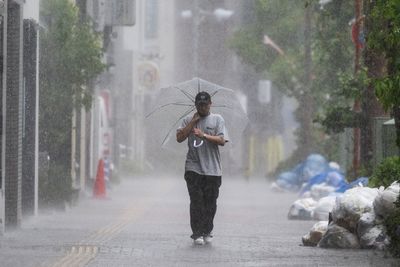 Torrential rain and flooding as Typhoon Jangmi hammers Japan