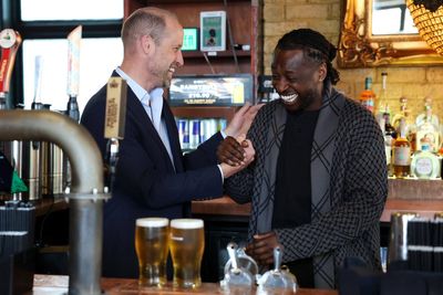 Prince William spotted behind the bar pouring pints at London pub