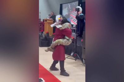 Military sister surprises graduating brother after year-long deployment