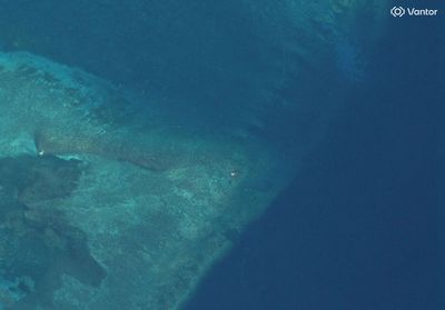 Satellite images show suspected structure at disputed South China Sea atoll, but later gone