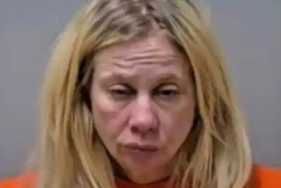 Driver charged in crash that killed an 82-year-old woman blames her dog