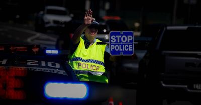 Car flips in pile-up crash, hospitalising two at New Lambton