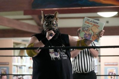 Wrestling matches provide an action-packed story time at US libraries, in photos