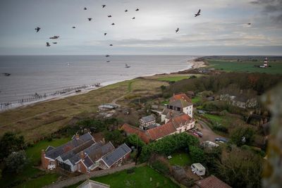 Grave in Norfolk of 119 sailors may be exhumed due to coastal erosion threat