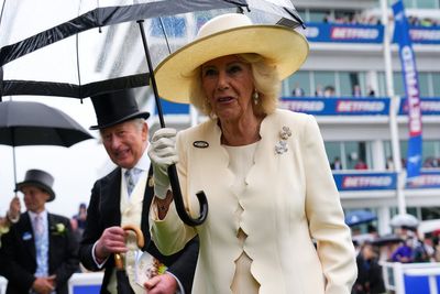King and Queen defy downpours to revive royal tradition at Epsom Derby