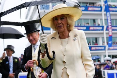 King and Queen defy downpours to revive royal tradition at Epsom Derby