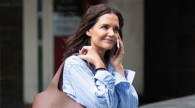 Katie Holmes elevates wide-leg jeans and a striped blue shirt with trending toe-post heels – creating the chicest smart-casual look