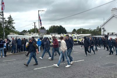 DUP MP defends photo with masked men at Scarva protest