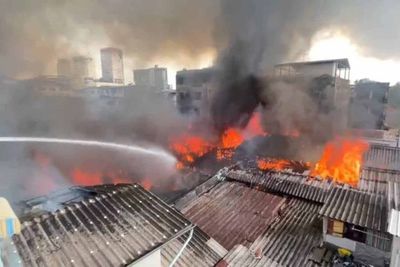 Bangkok community evacuated, fire destroys homes