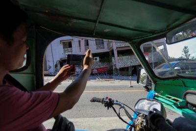 Philippines earthquake death toll rises as landslides triggered and buildings collapse