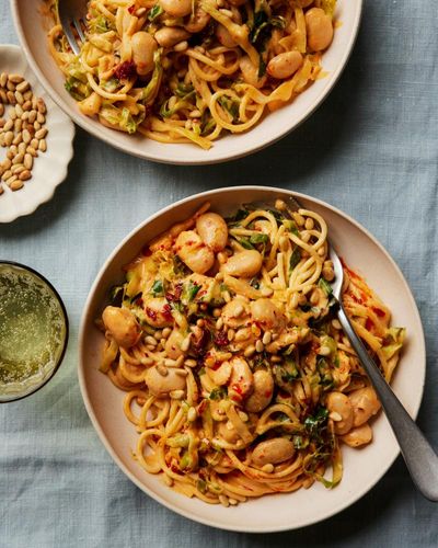 Rukmini Iyer’s quick and easy recipe for spaghetti with spring greens, butter beans and harissa