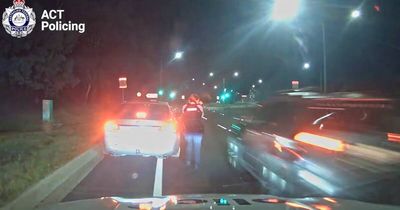 Driver 'clipped a police car,' almost struck officer before driving away