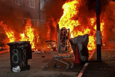 Belfast stabbing latest: Homes and cars set ablaze as protesters accused of ‘thuggery’ after knife attack