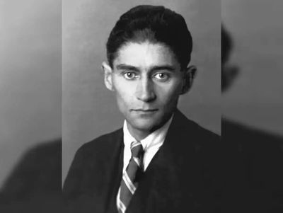 Quote of the Day by Franz Kafka: 'Reality is too heavy for people, so they rent illusions...' -A powerful lesson that exposes our search for escape by the Absurdist fiction novelist known for his Kafkaesque writing style
