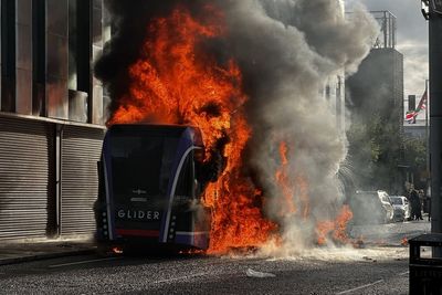 Bus set alight by masked protesters as police dealing with ‘pockets of disorder’