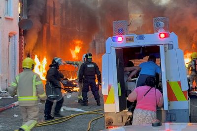 Residents forced to evacuate as protestors set homes and cars on fire following Belfast stabbing