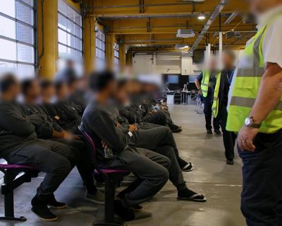 Staff at immigration detention centre wore England flags, report finds