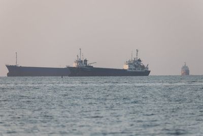 Iran-US war latest: Gunmen fire at cargo ship near key trade route as Tehran threatens to pull out of peace talks