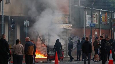 Cars and homes burn as unrest erupts in Belfast after knife attack