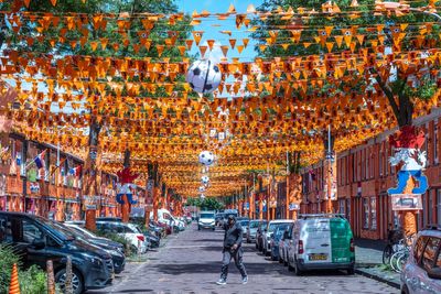 A street in The Hague is drenched in orange as Netherlands soccer fans celebrate the World Cup